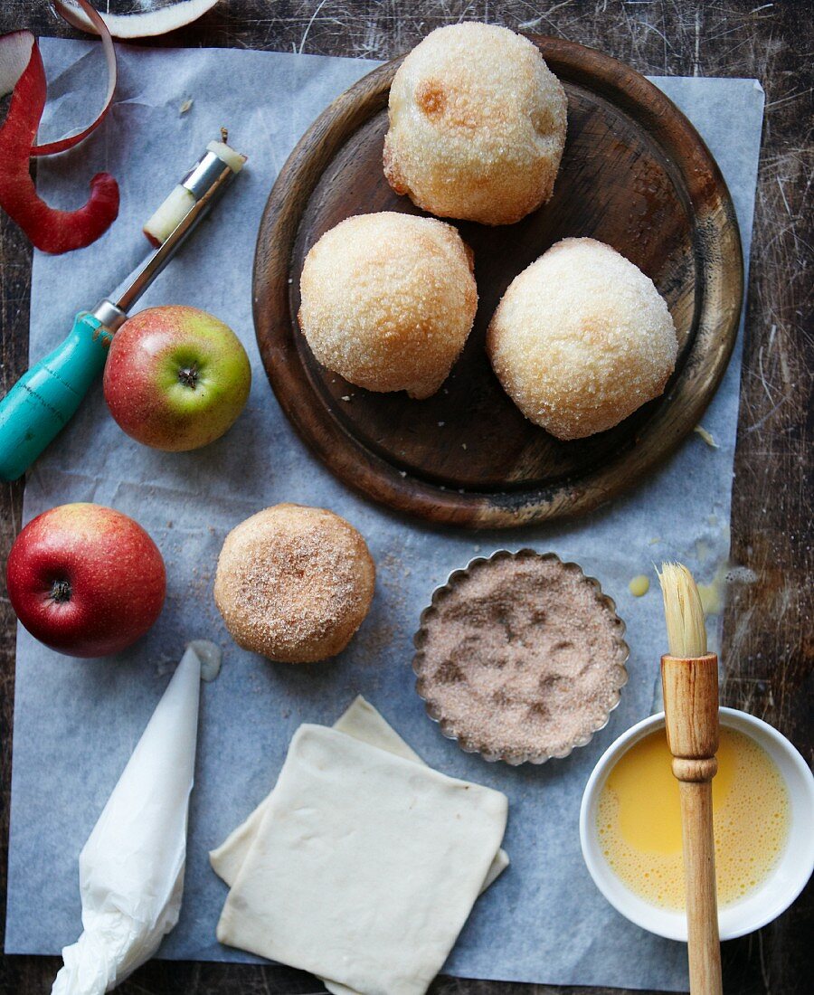 Pastry-wrapped apples with cinnamon sugar and ingredients