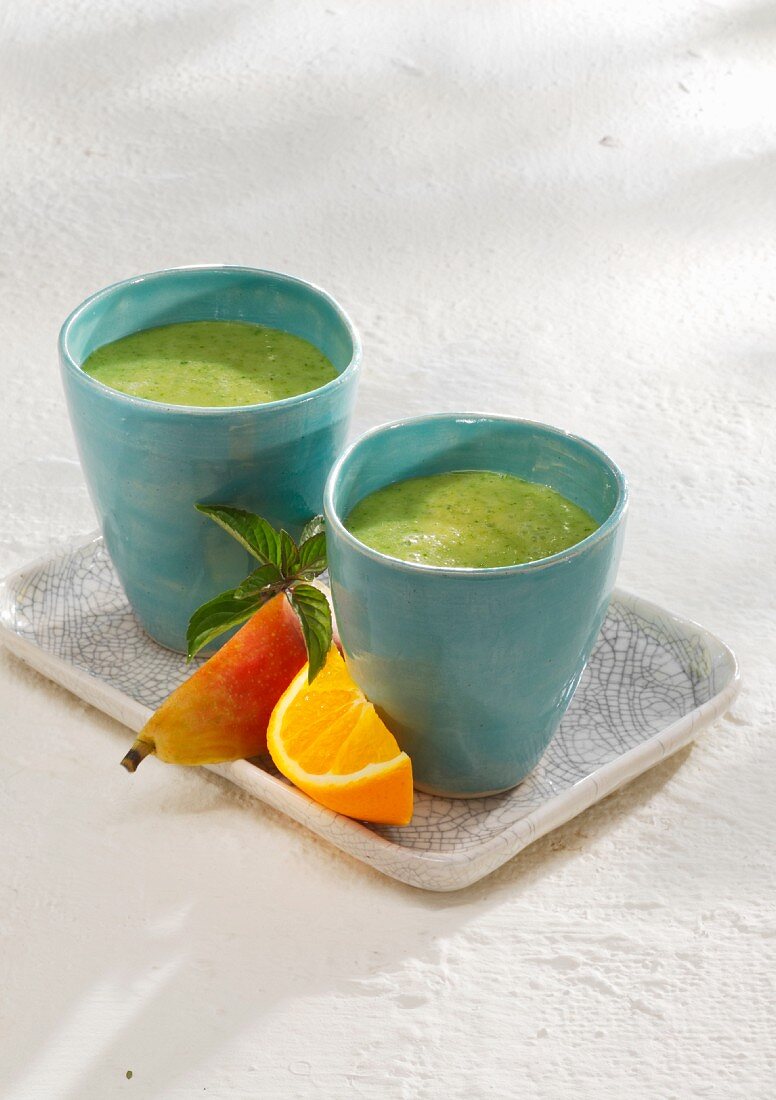 Kale smoothies with banana, pears, orange juice and almond milk