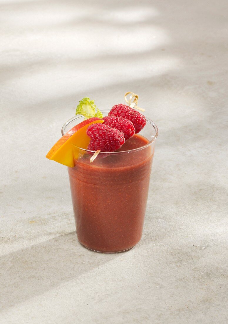 A raspberry and kale smoothie with mango and ginger