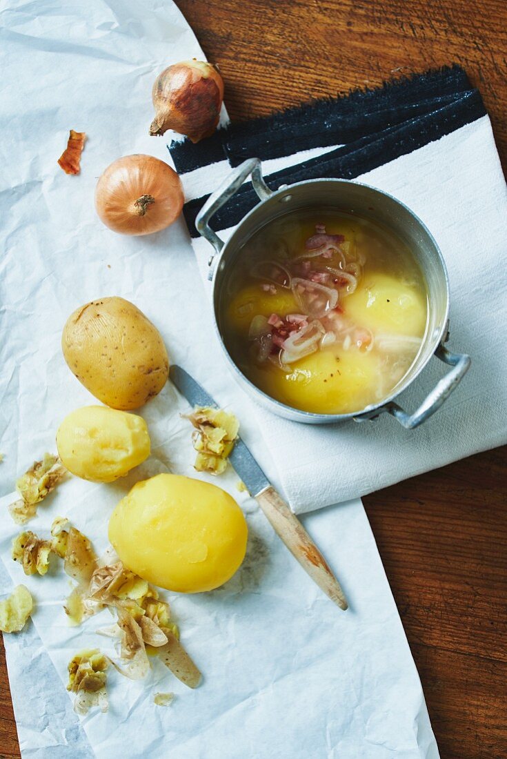 Peeled potatoes in a marinade