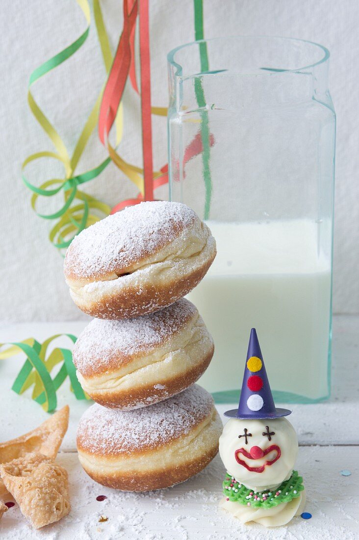 A stack of doughnuts dusted with icing sugar