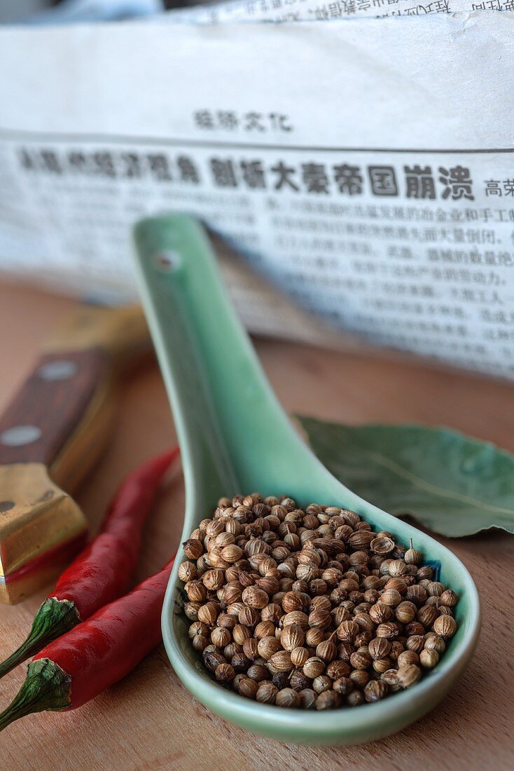 Chinese coriander seeds on a spoon