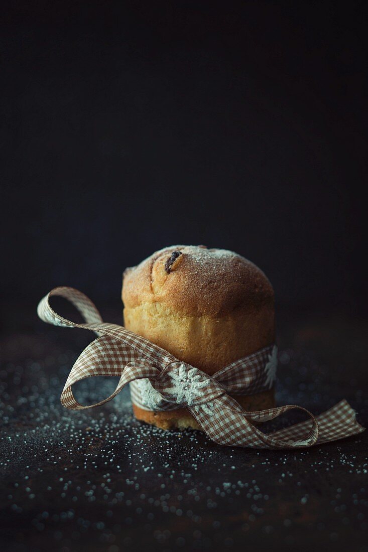 A mini panettone tied with a ribbon