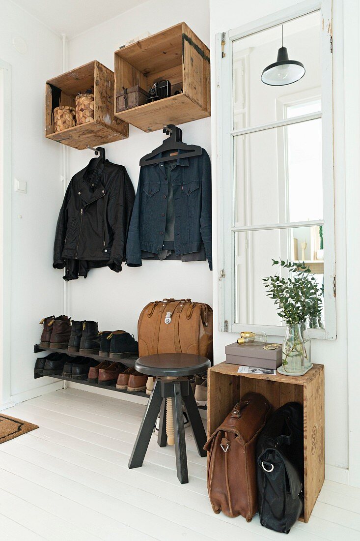 Cloakroom furnishings made from old wooden crates in vintage-style hallway