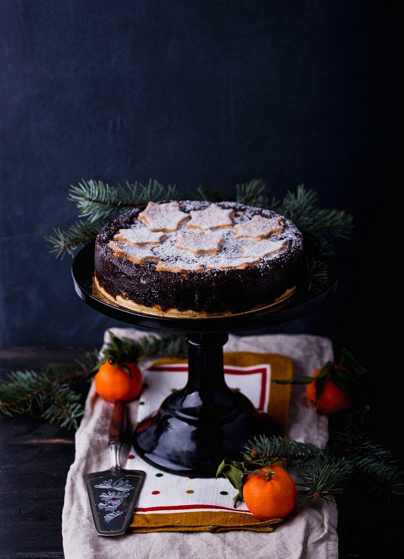 A poppyseed cake on a cake stand (Christmas)