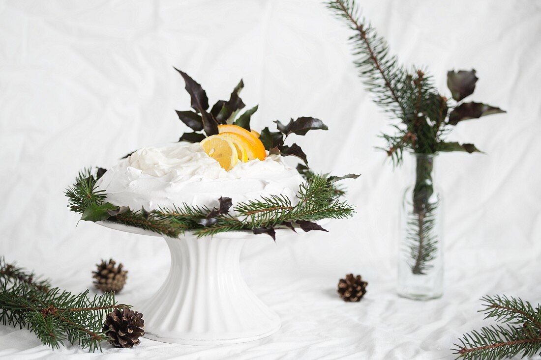 Pavlova with cream, lemons and oranges for Christmas