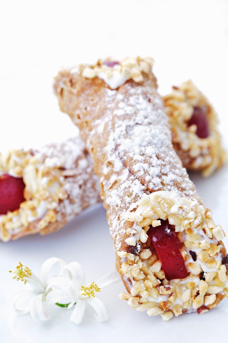 Cannoli siciliani (fried pastry rolls filled with ricotta cream, Italy)