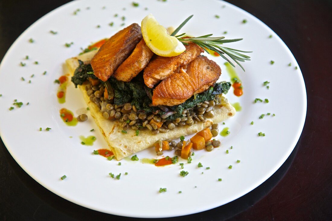 Savoury crepes with lentils, spinach and salmon