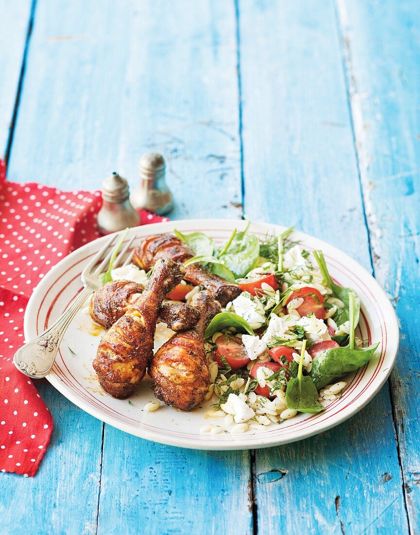 Spicy grilled chicken legs with salad