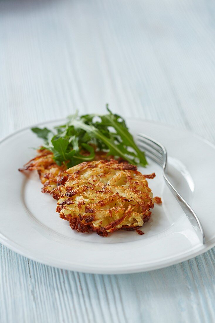 A potato fritter with rocket