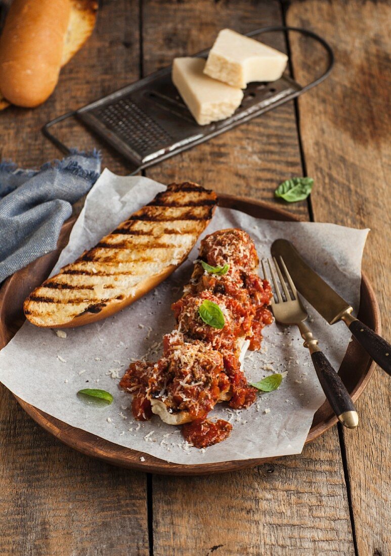 A grilled Subway sandwich with meatballs and Parmesan cheese
