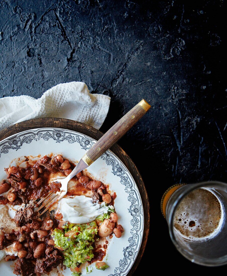 Chilli con carne with guacamole and sour cream