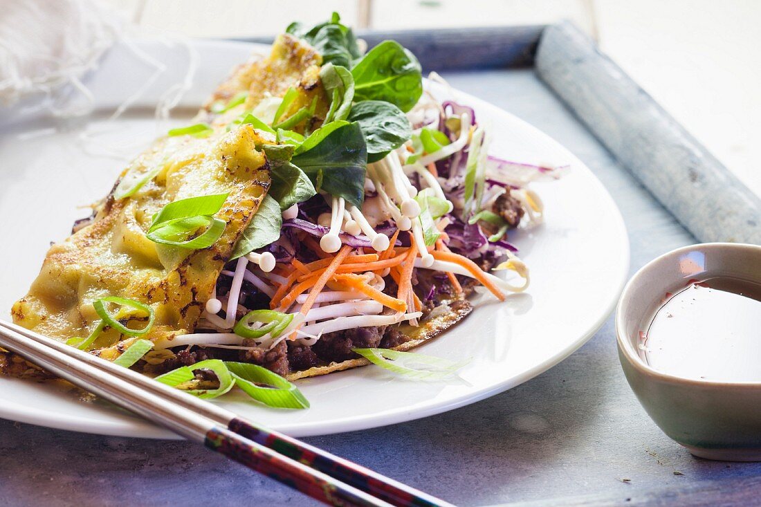 Banh Xeo (Vietnamese crêpes) with minced meat and vegetables