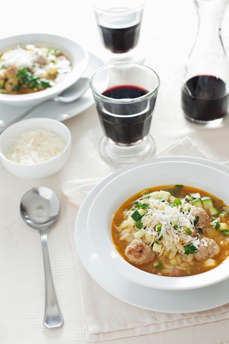 Mediterranean soup with orzo pasta, meatballs and courgettes