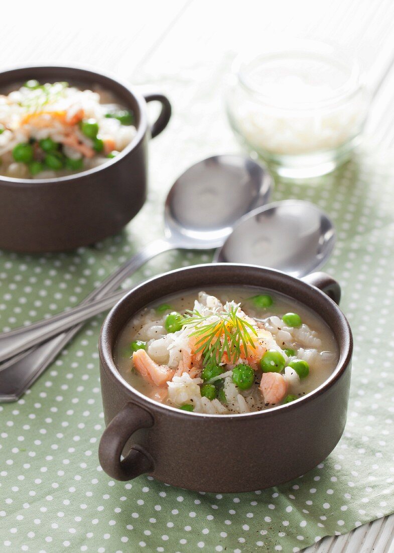 Soup with risotto rice, salmon and peas