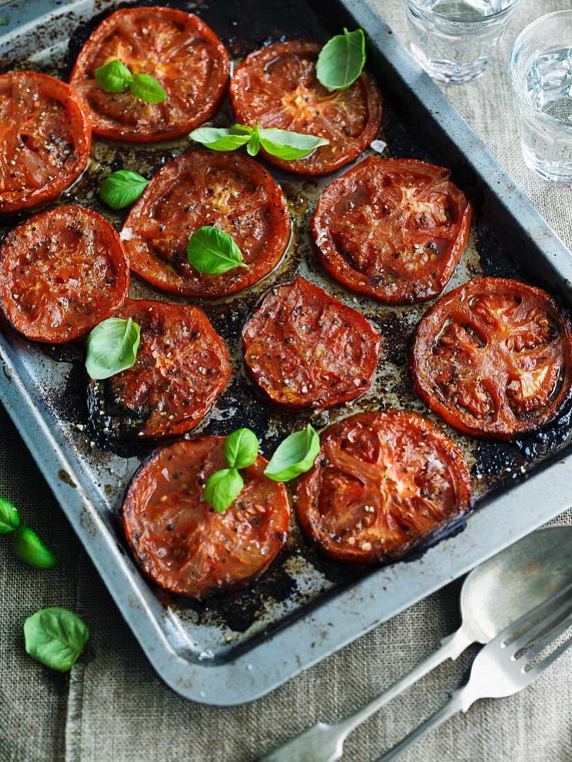 Oven-baked tomatoes with basil