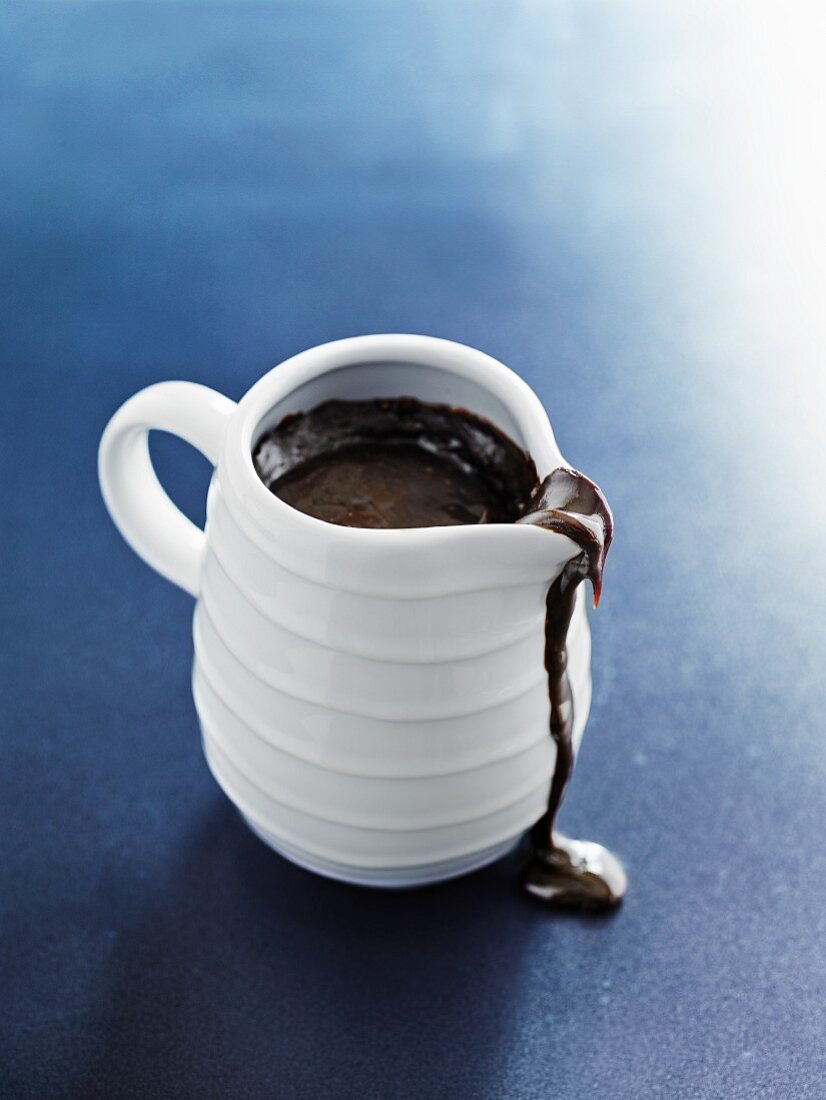 Chocolate sauce in a white jug