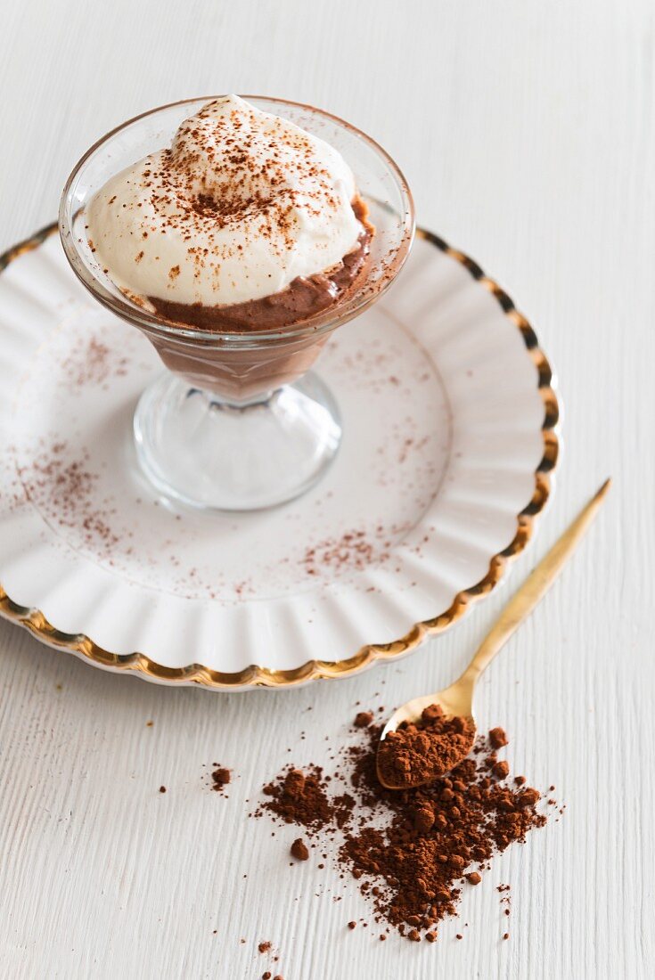 Chocolate mousse with cream and cocoa powder