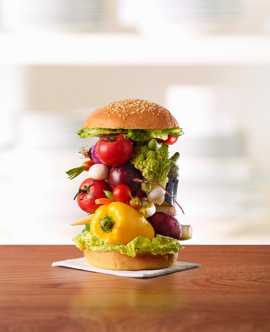 A stack of vegetables in a burger bun