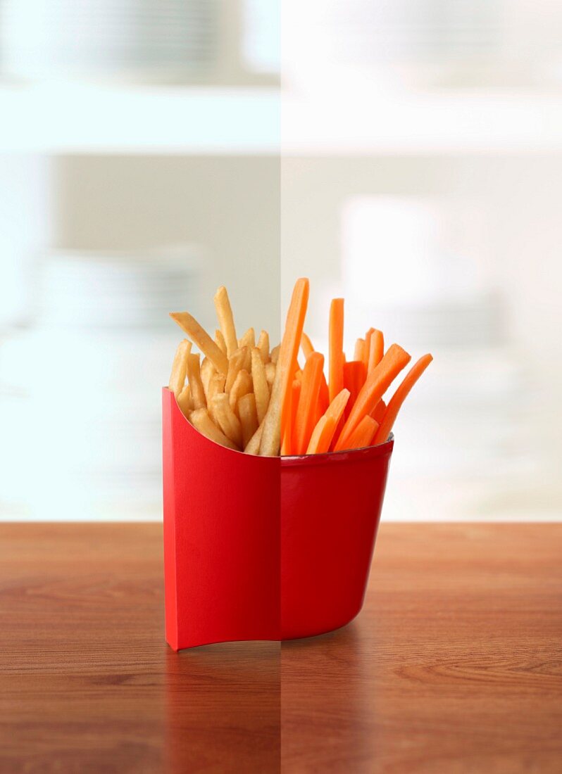 Half a packet of fries and half a cup of carrot crudites (photo collage)