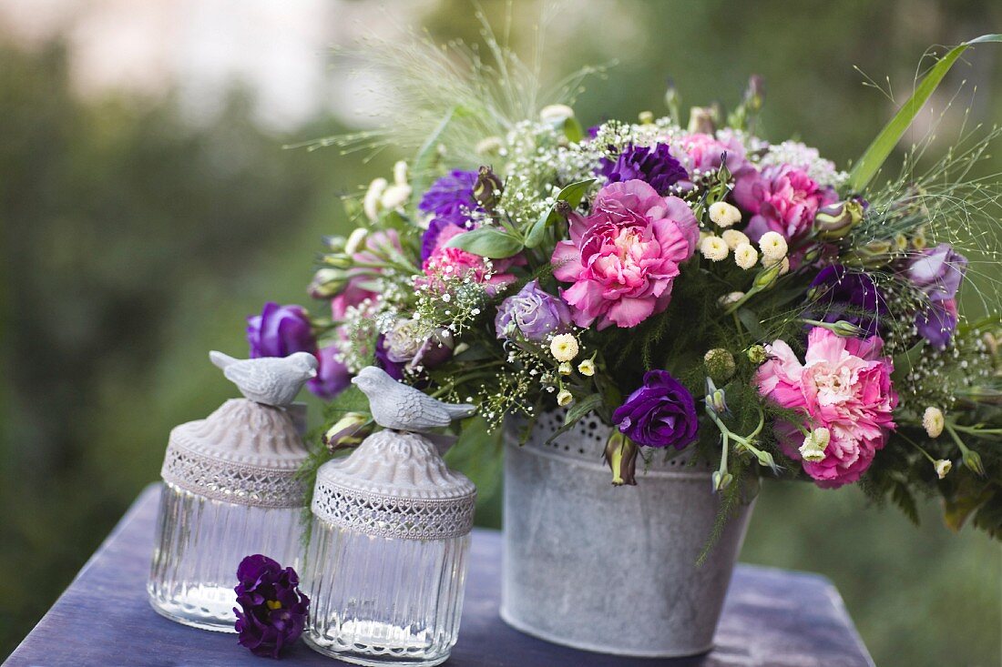 Romantic, summery bouquet on table outdoors