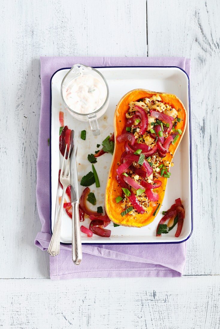 Oven-baked pumpkin filled with quinoa, chicken and caramelised onions