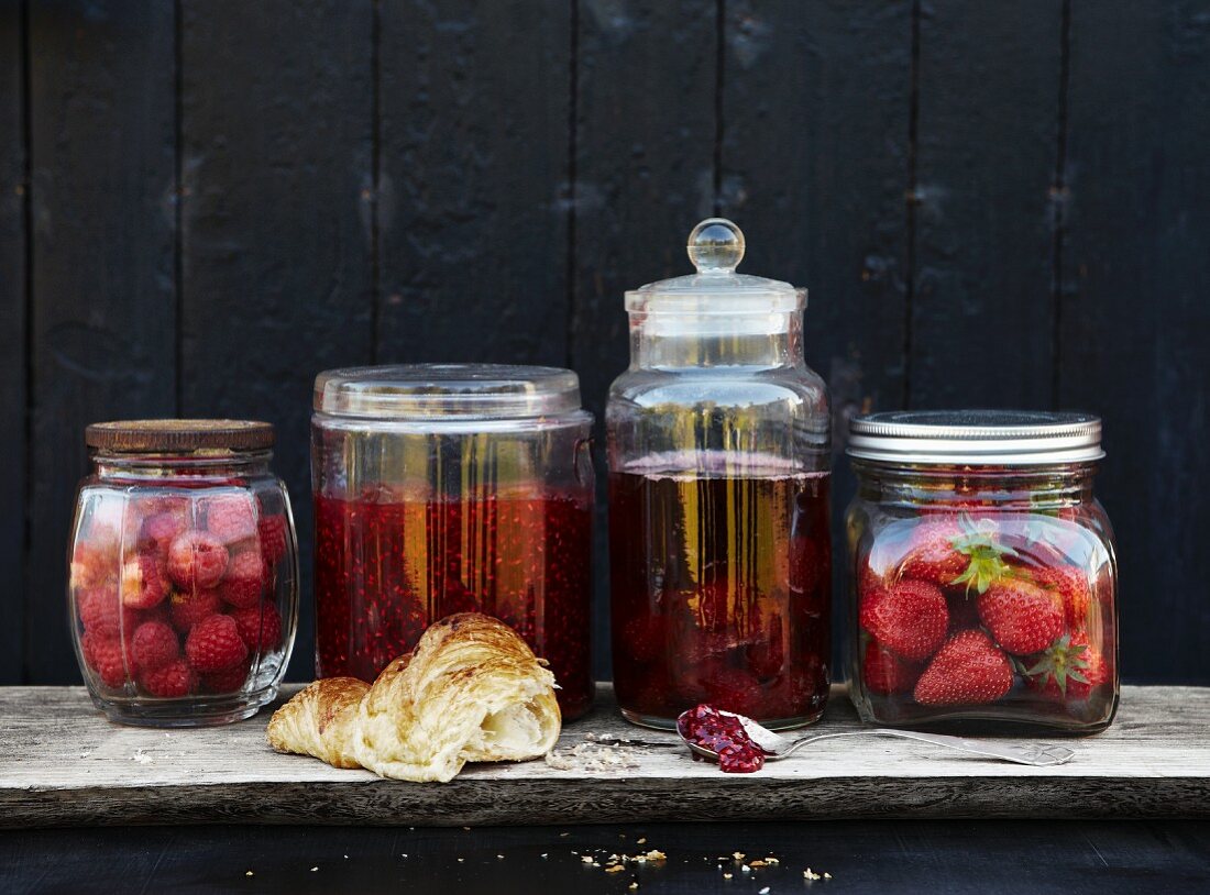 Raspberry jam, strawberry jam and a croissant