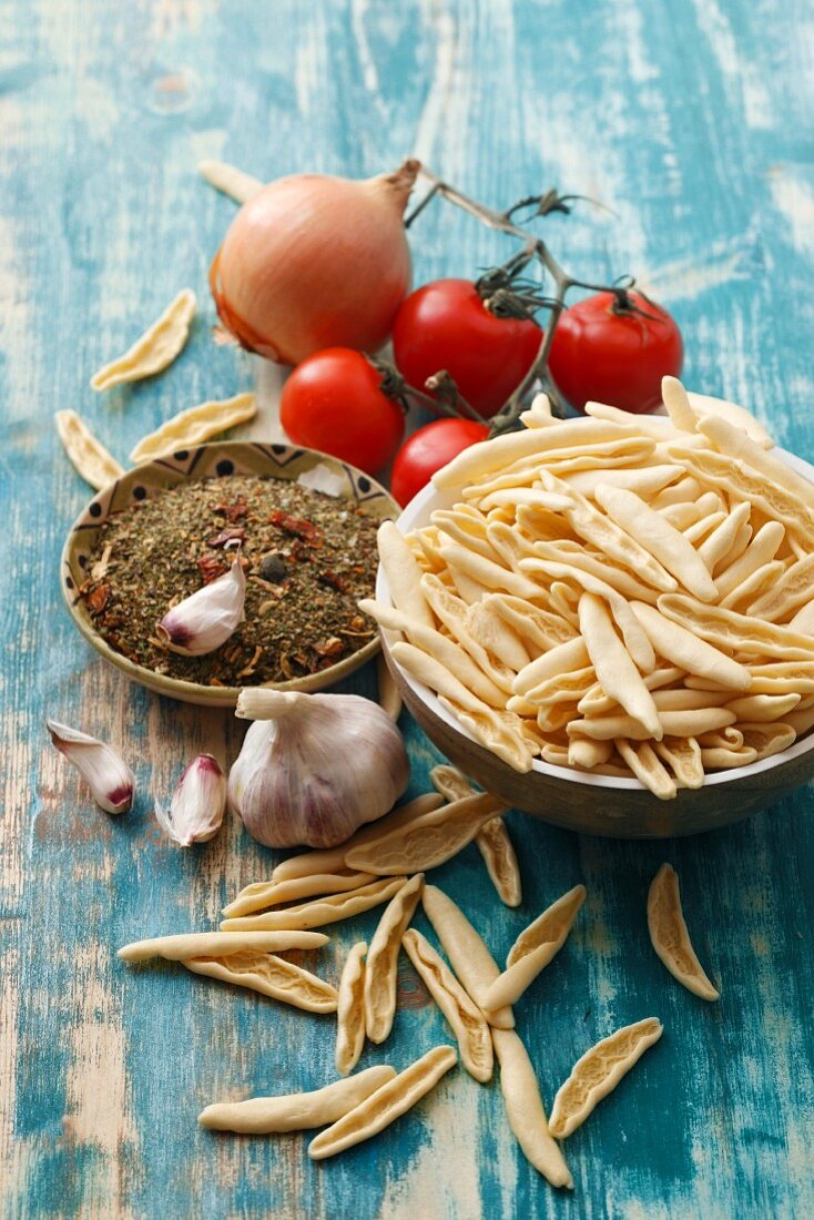 Capunti and ingredients for puttanesca sauce