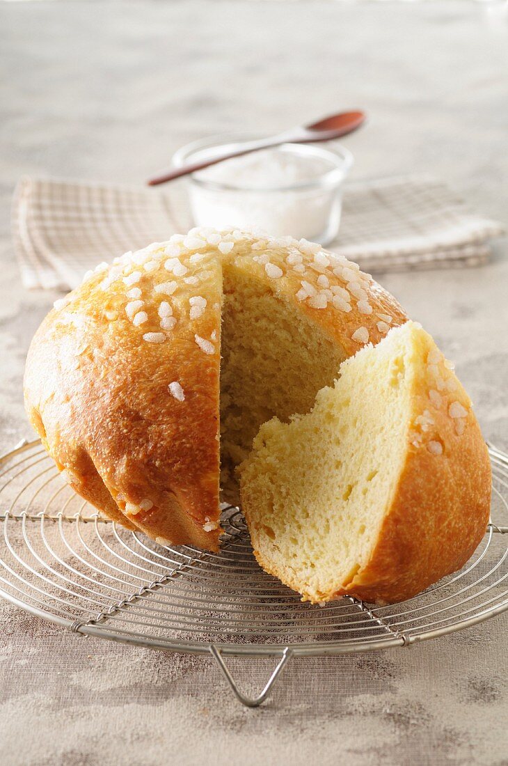 Pastis Landais (French yeast dough cake) on a cooling rack