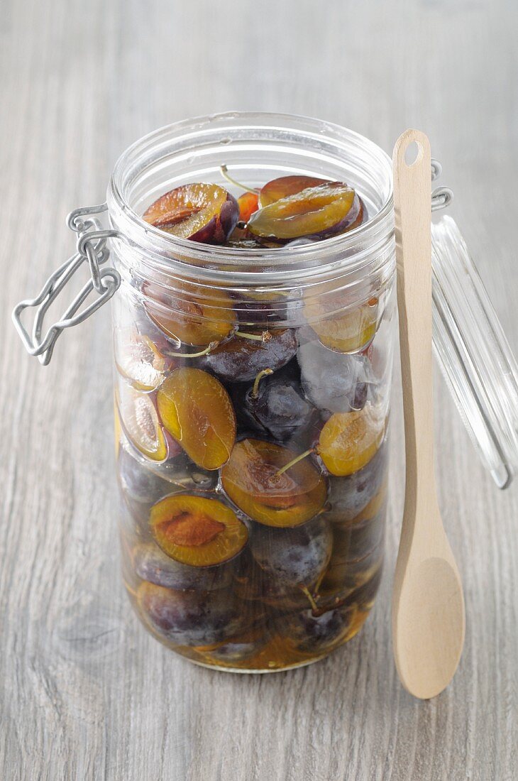 Sweet-and-sour preserved damsons in a jar