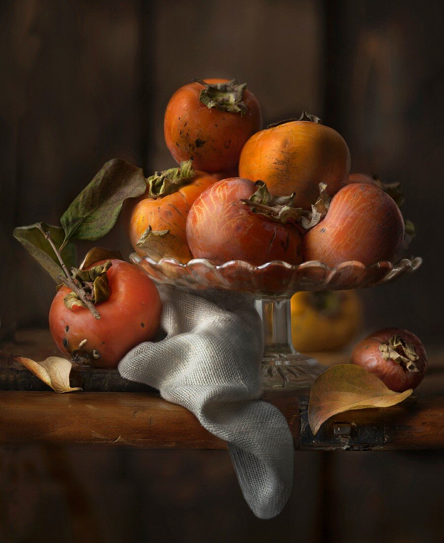 Persimmons in a fruit bowl