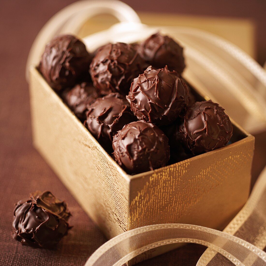 Truffle pralines in a golden box