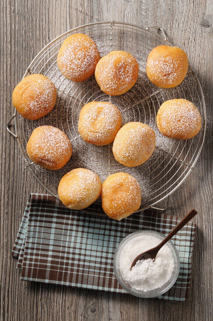 Sugared doughnuts on a wire rack