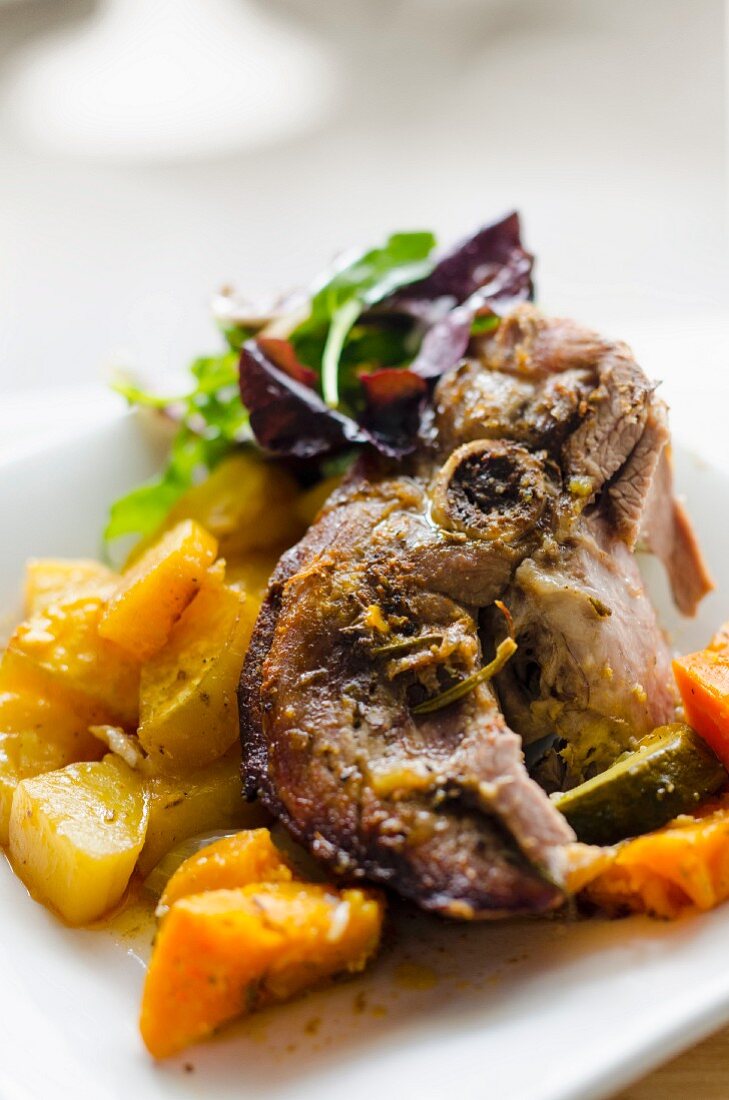 Lamb on a bed of vegetables