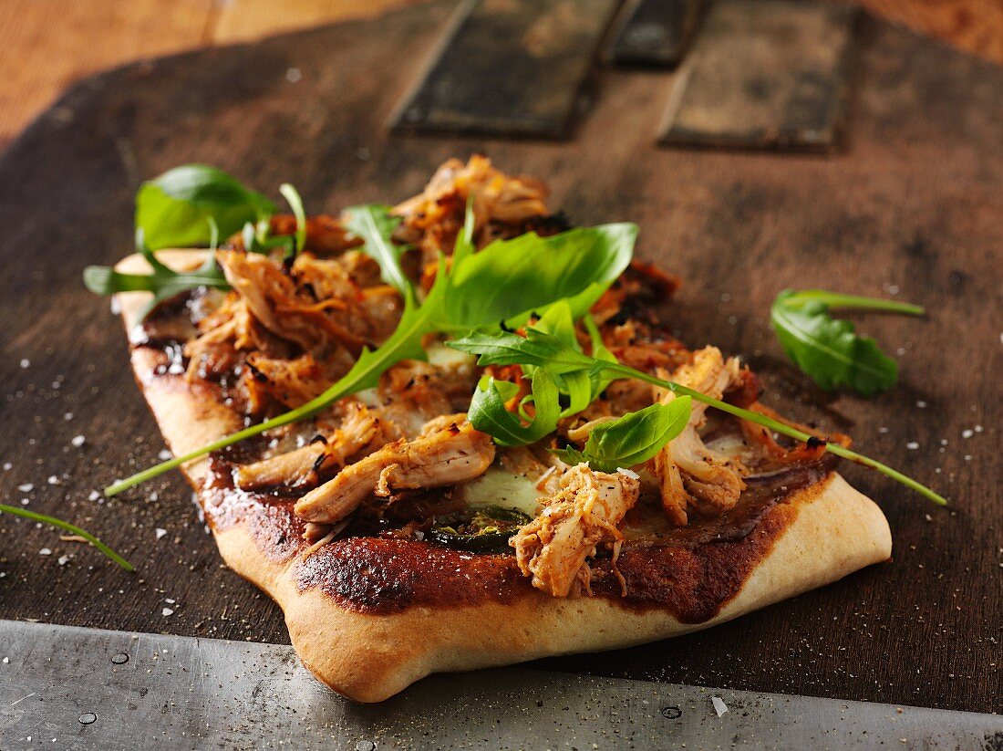 Pulled pork pizza with rocket