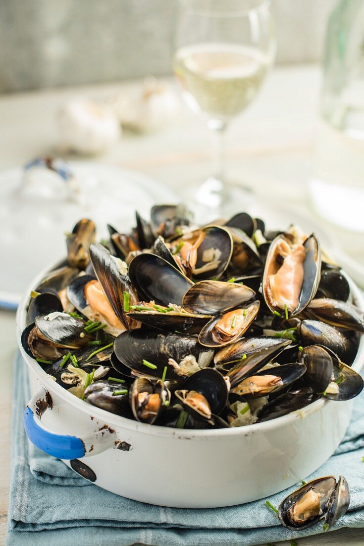 Mussels in a white wine broth with garlic and herbs