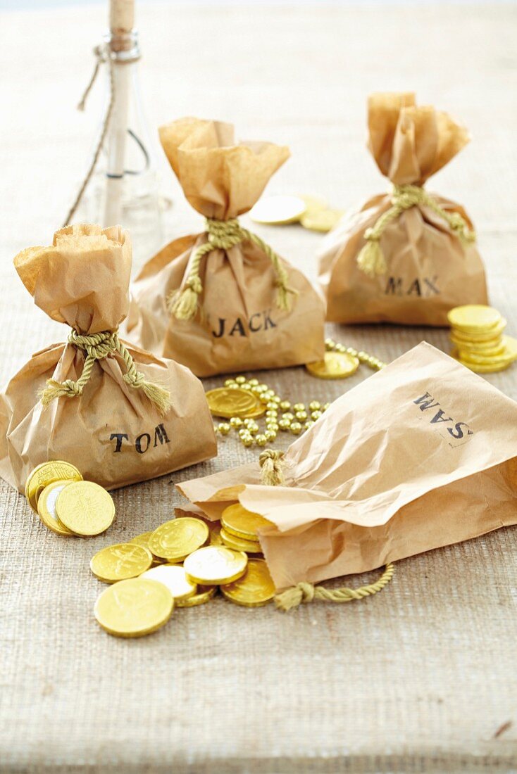 Homemade sacks of chocolate coins for a pirate party