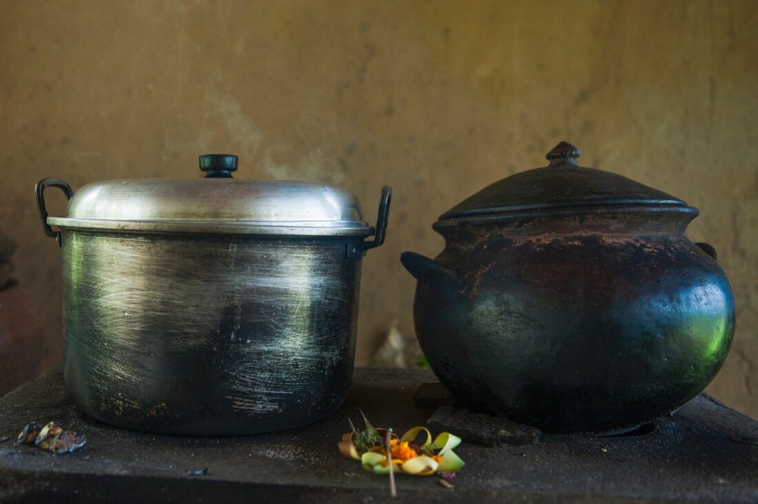 Oriental iron and steel pots on a kitchen counter