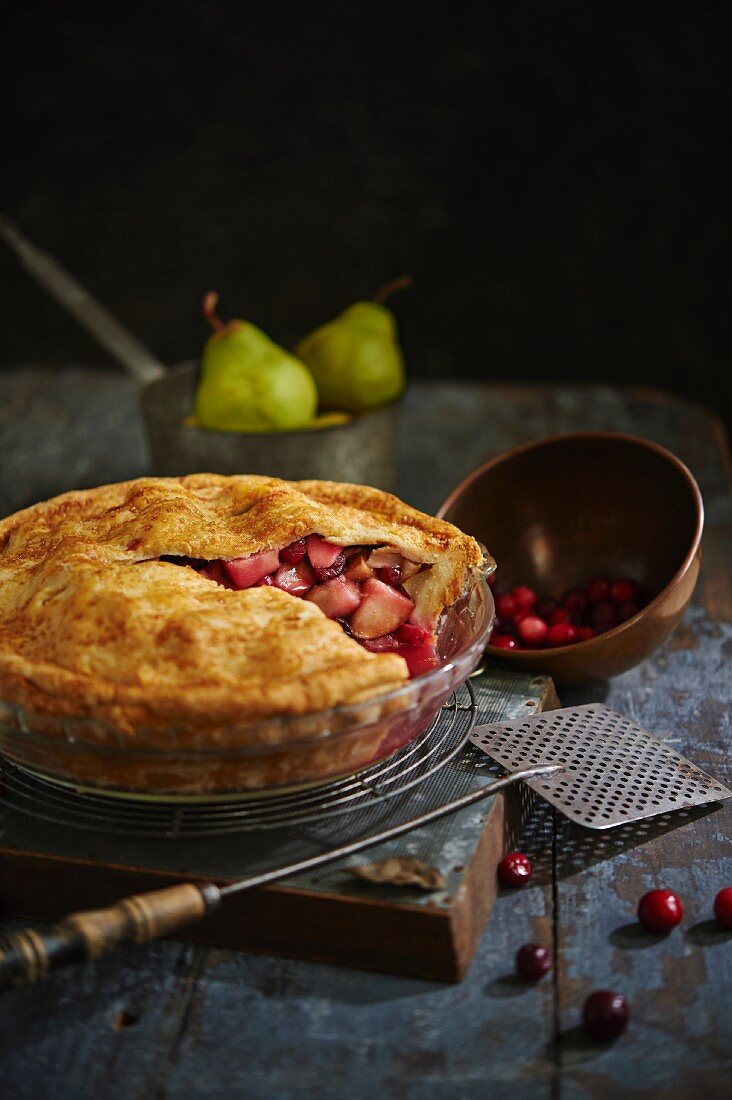 Autumnal fruit pie with pears and cranberries