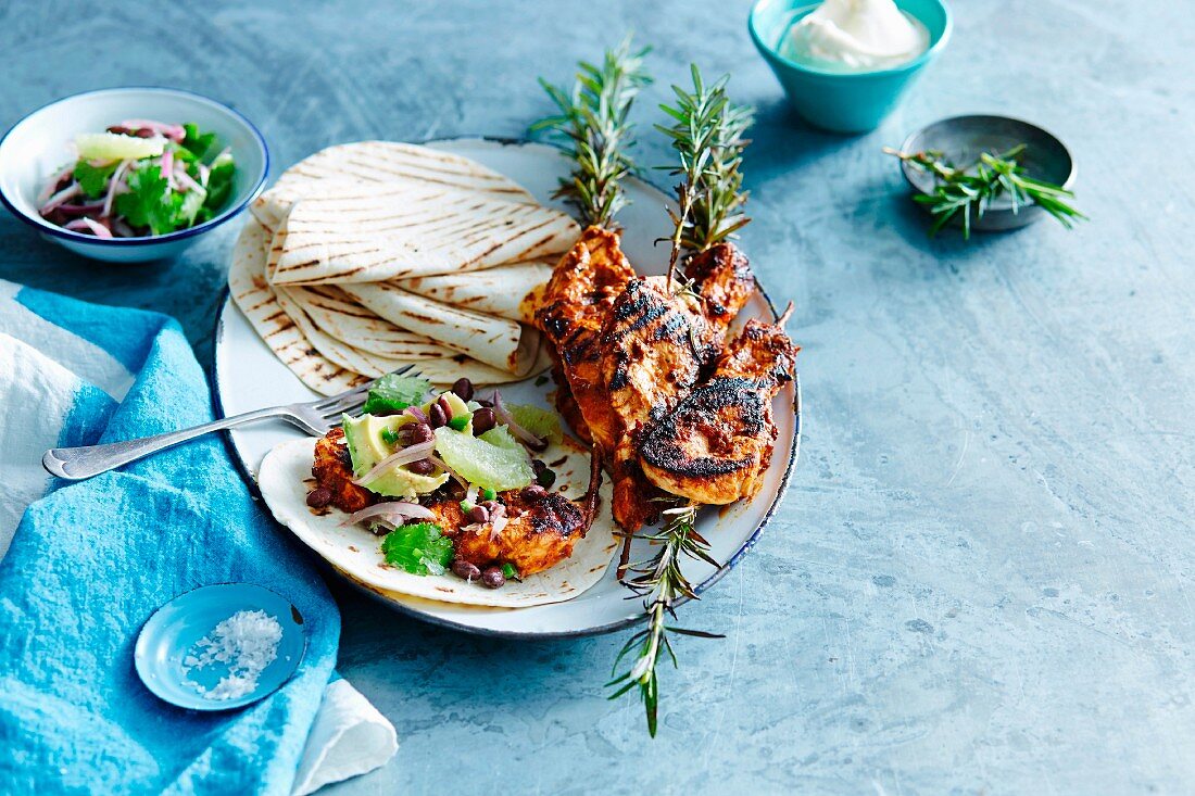 Tortilla wraps with grilled chilli chicken and a bean salsa