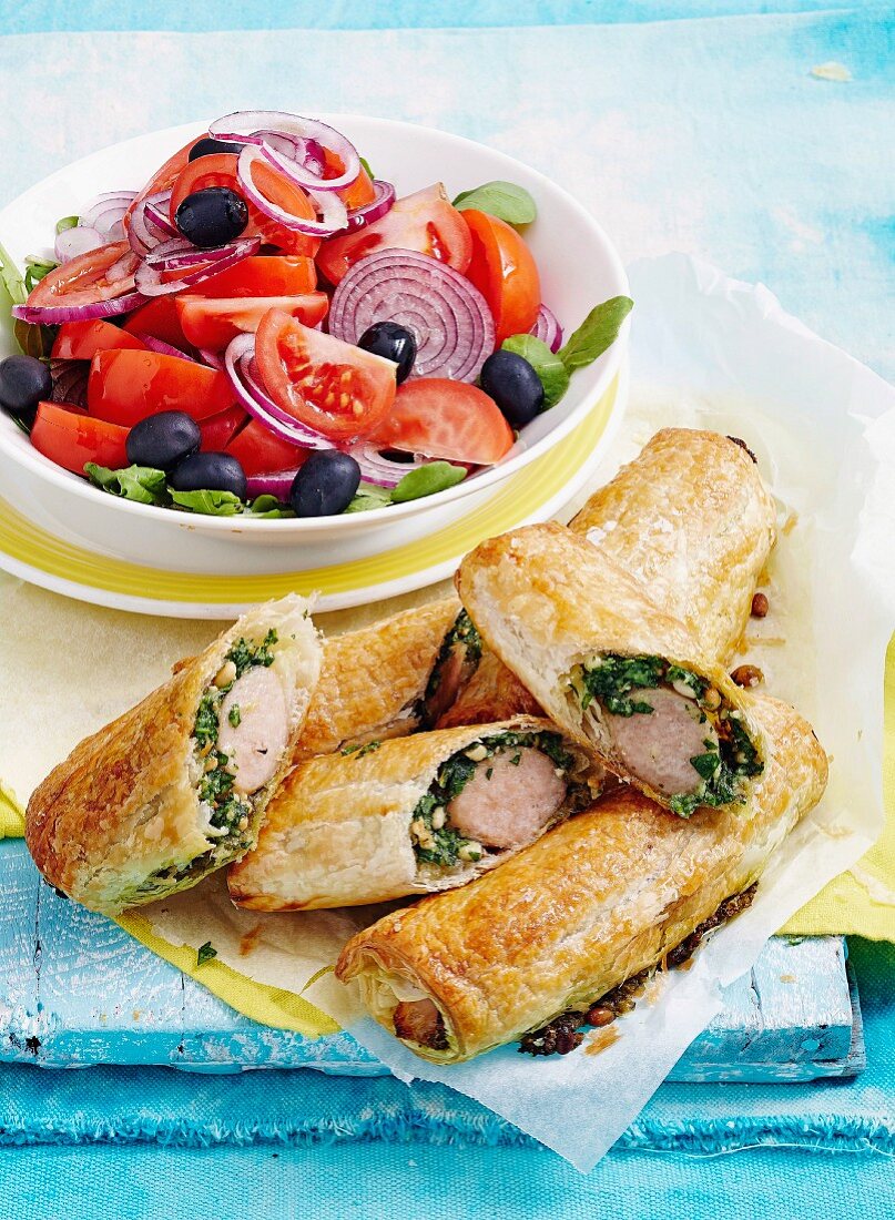Mediterranean sausage rolls with tomato and olive salad