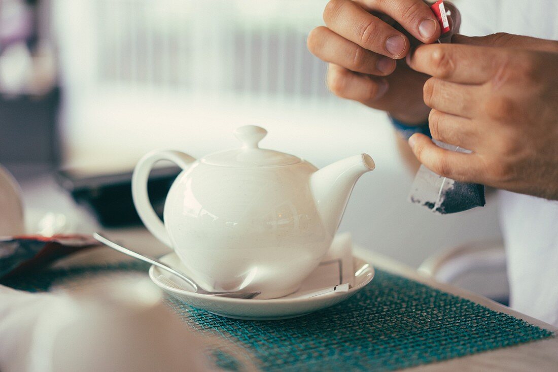 A white teapot in a restaurant