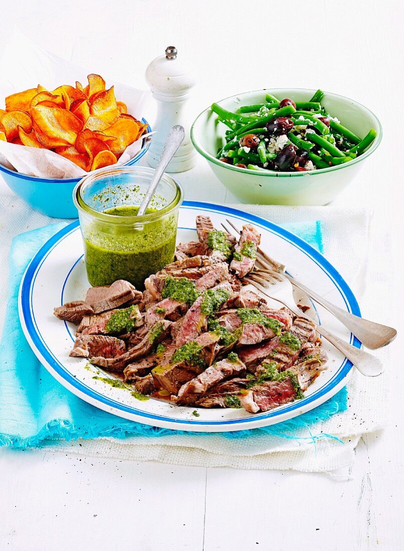 Beef with salsa verde, sweet crisps and bean salad