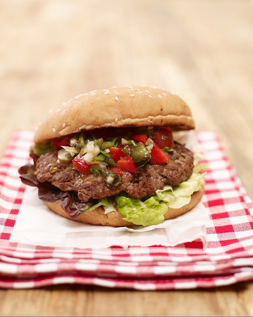 Grilled burger with chilli salsa