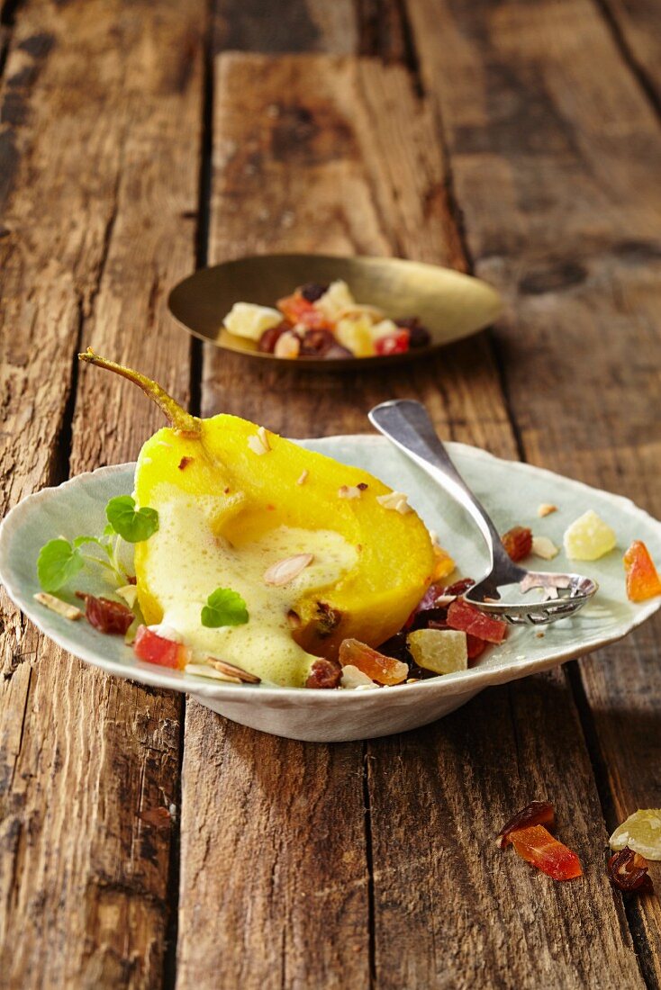 A preserved Williams pear with marinated dried fruits, stevia cress and almond foam