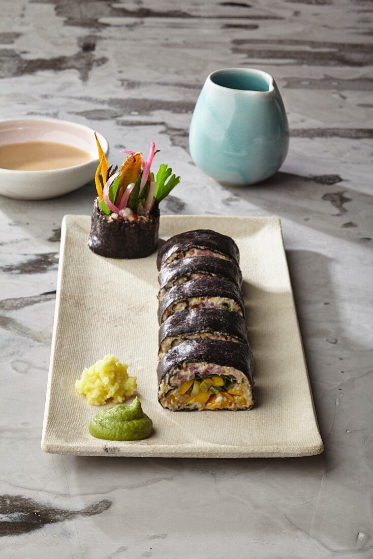 Courgette sushi in nori sheets with coconut and hoisin sauce and Thai basil