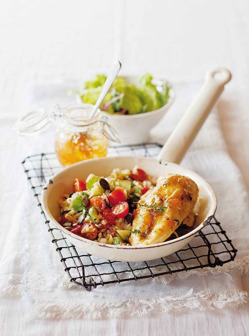 Chicken breast with a marmalade glaze on a rice salad