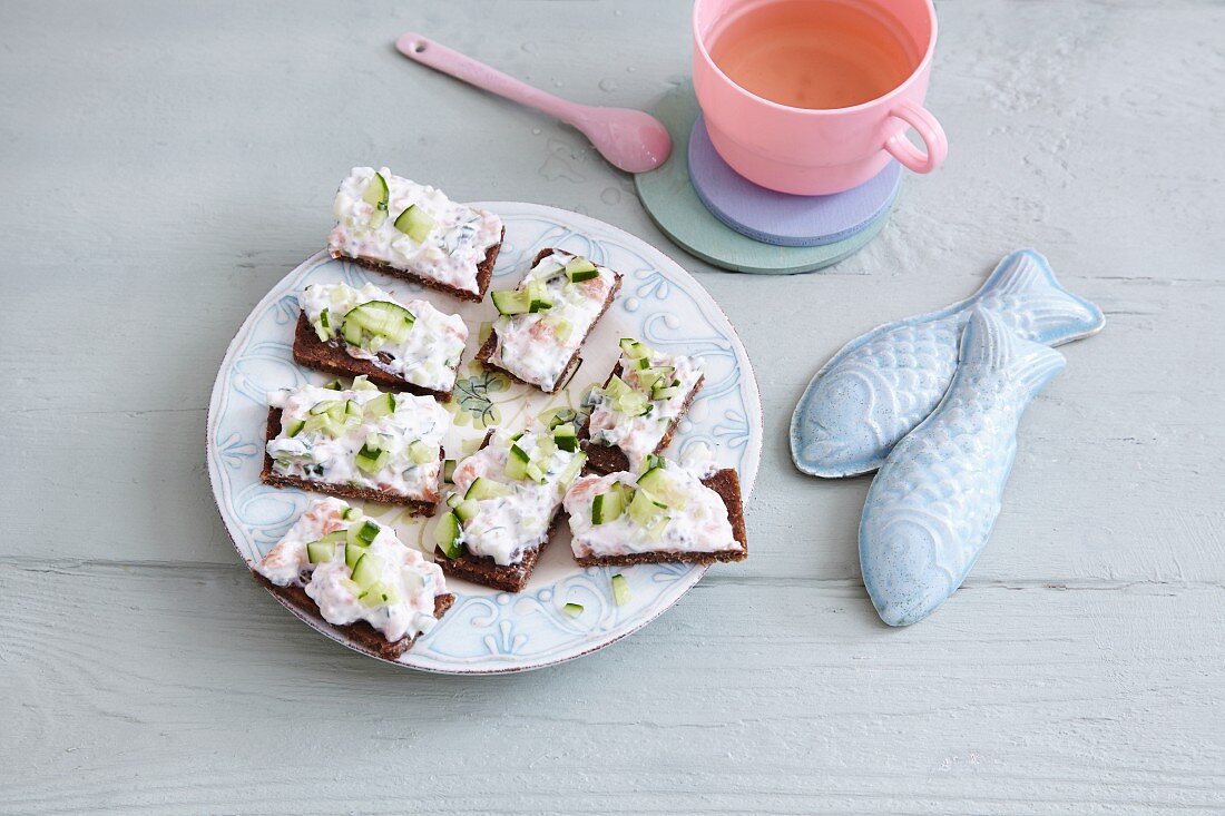 Salmon and cucumber sandwich on pumpernickel bread