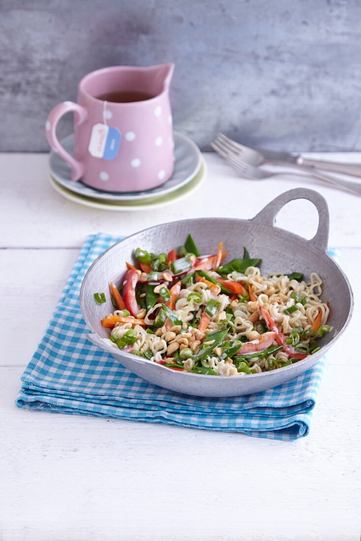 Stir-fried noodles with vegetables and peanuts