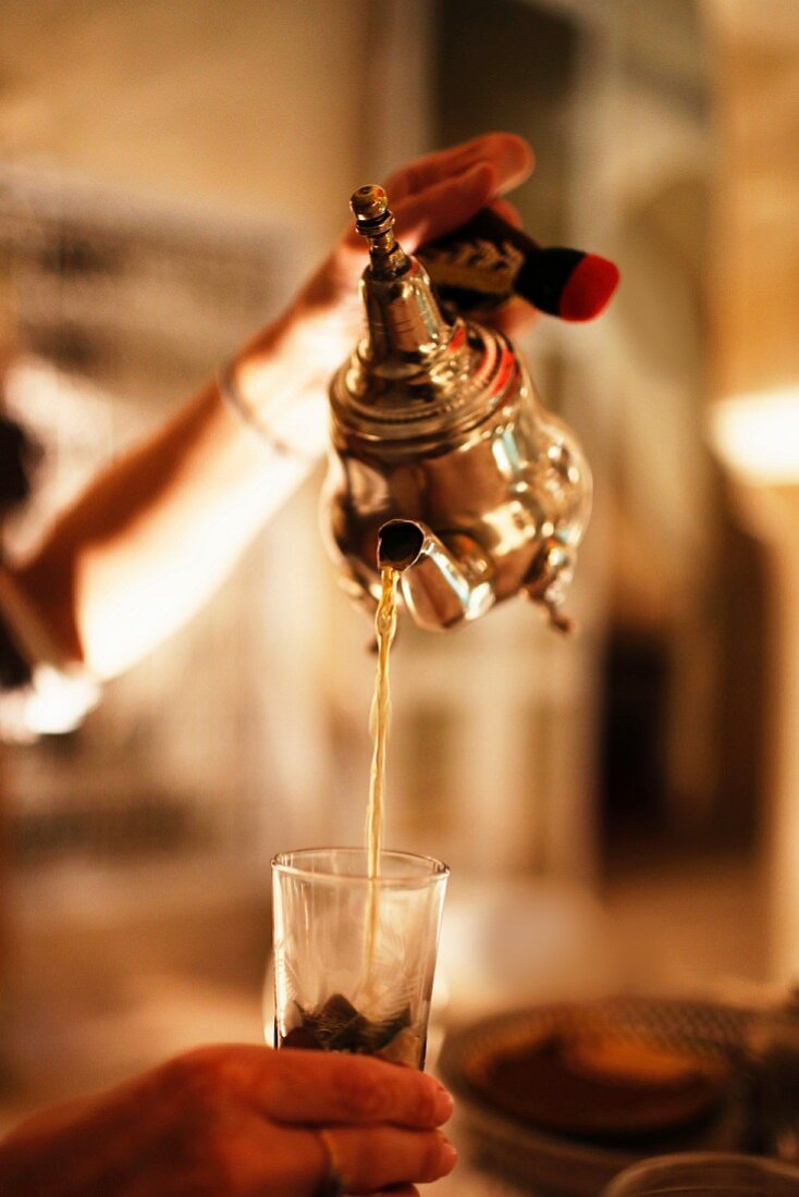 Mint tea being poured, Marrakesh, Morocco